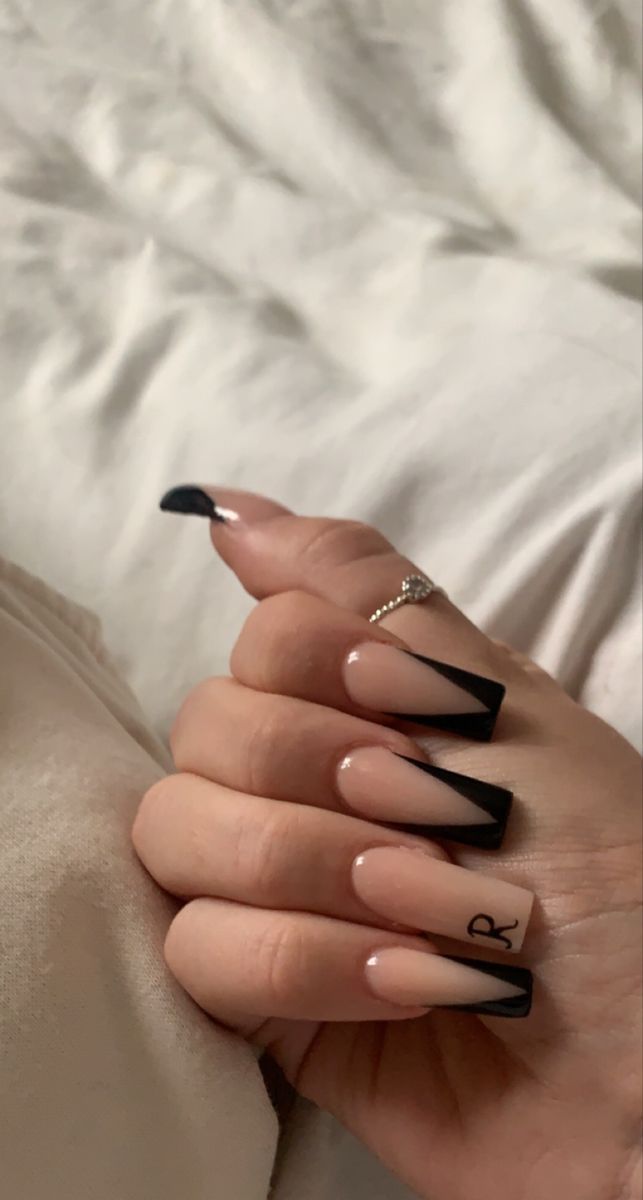 Modern Chic: Bold Black French Tips with a Unique Flair