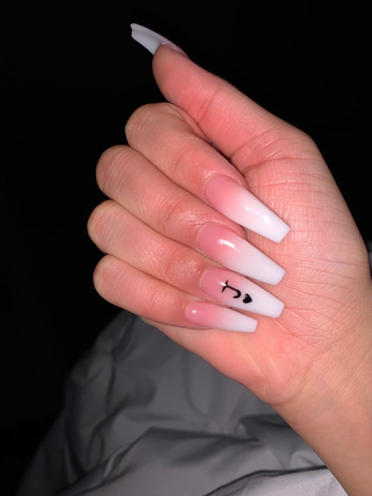 Chic Almond-Shaped Gradient Nail Design with Minimalist Symbols.