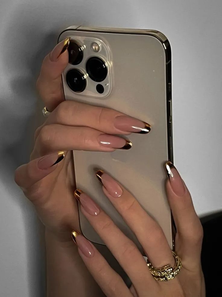 Sophisticated Elegant Nude and Gold Nail Design for Chic Occasions.