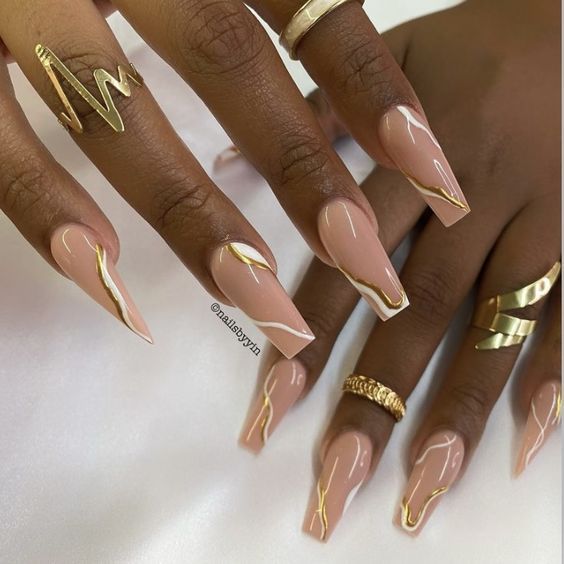 Sophisticated Elegant Nude Nails with Glossy Finish and Modern Gold Accents