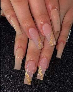 Chic Ombre Nails: Soft Pink and Nude with Glamorous Gold Accents.