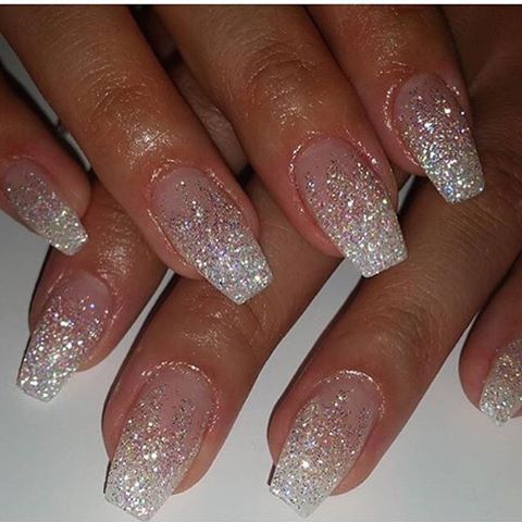 Elegant Sparkling Ombre Nails: A Dazzling Transition from Nude to Glittering White Tips.