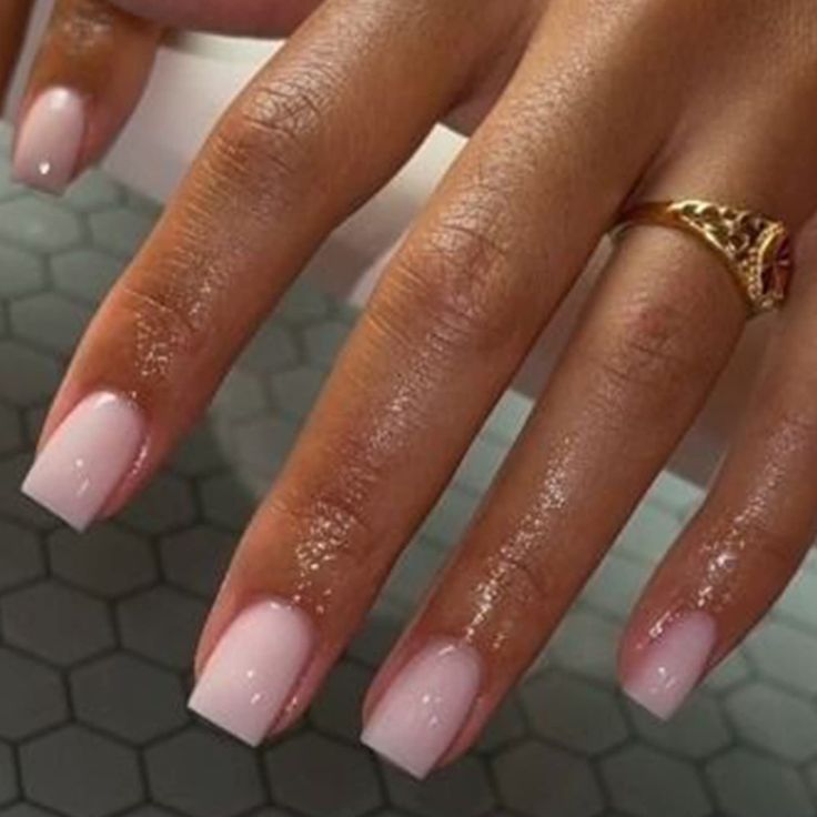 Sophisticated Ombre Nail Design with Glossy Finish and Chic Accessory.