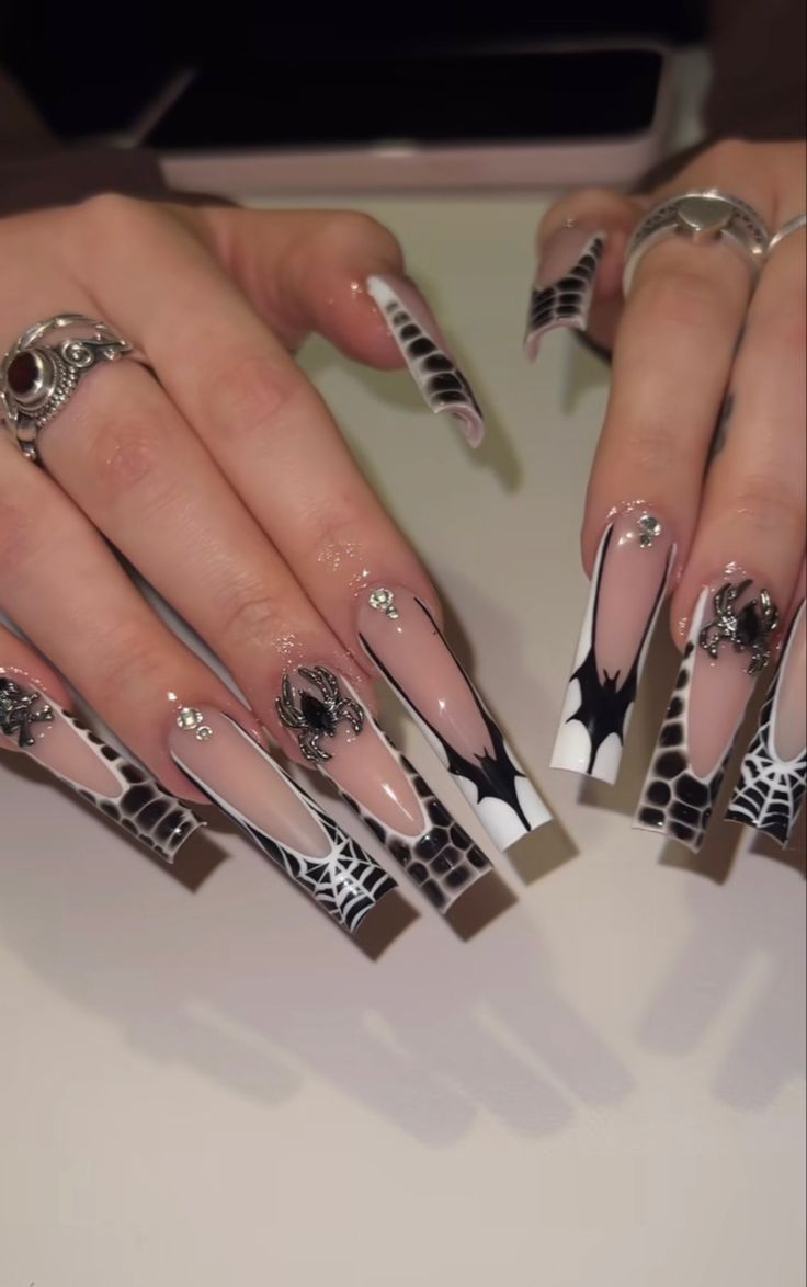 Glamorous Spider Web Nail Design with Dramatic Shapes and Elegant Accents.