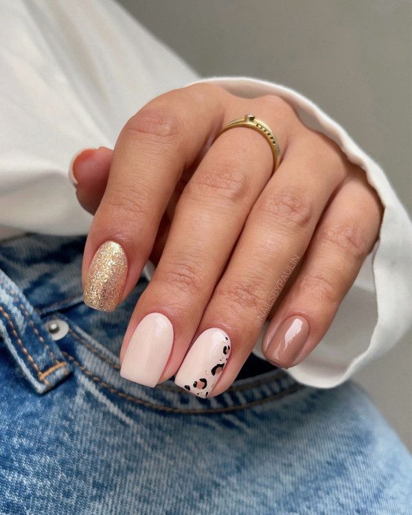 Chic Pastel Nail Design with Glitter and Trendy Animal Print Accents.