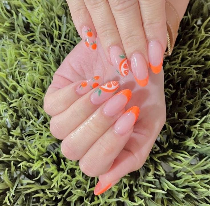 Vibrant Orange Accented Nail Design with Playful French Tips and Hand-Painted Fruit Motifs.