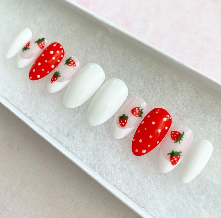 Playful Strawberry Nail Design: Bold Red with Polka Dots and Delicate White Accents