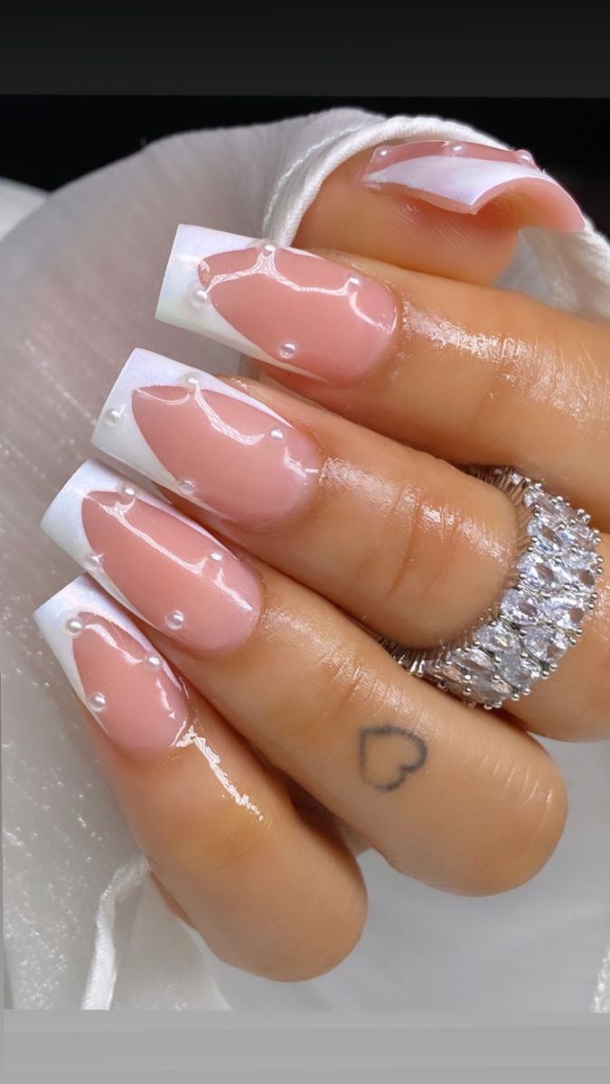 Sophisticated Neutral and White Nail Design with Glossy Finish and Unique Texture.