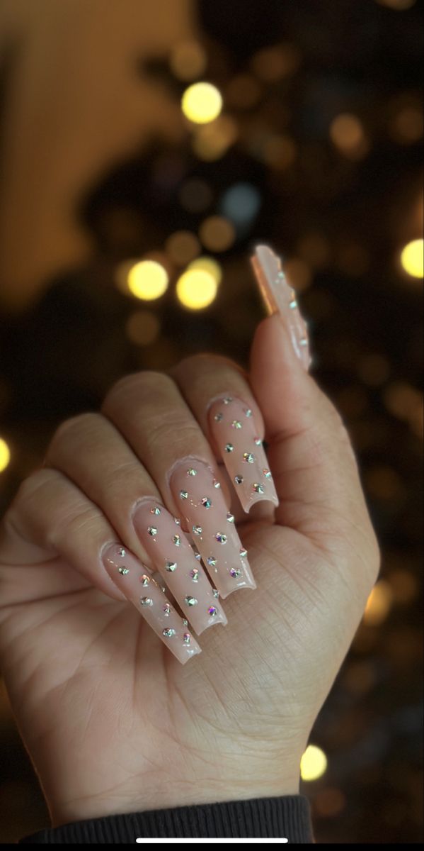 Elegant Coffin-Shaped Nail Design with Sparkling Rhinestones on a Nude Base.