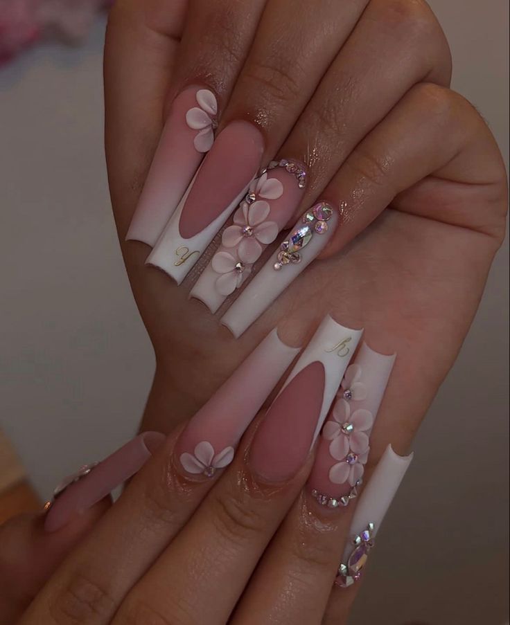 Elegant Gradient Nail Design with Floral Embellishments and Rhinestones.