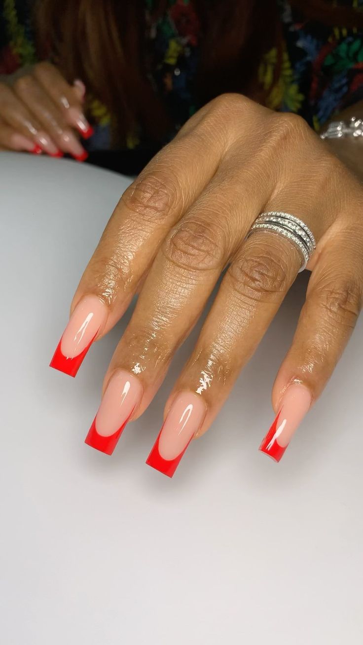 Modern Red-Tipped Nail Design: Elegant Contrast with a Nude Base