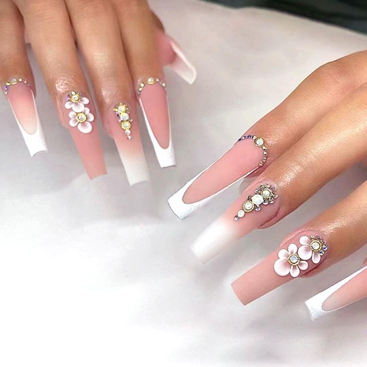 Chic Elegant Nail Design with Soft Pink, White, Floral Embellishments, and Rhinestones.