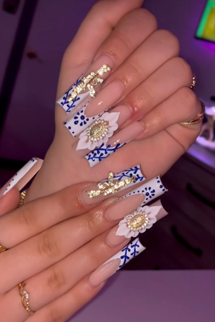 Sophisticated Floral Nail Art with Nude and Blue Tones, Accented by Gold and 3D White Flowers.