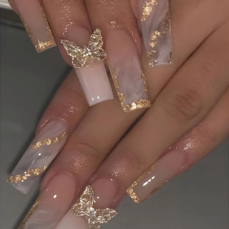 Chic Nail Design: Glossy Nude and Marble with Gold Leaf and Butterfly Accents