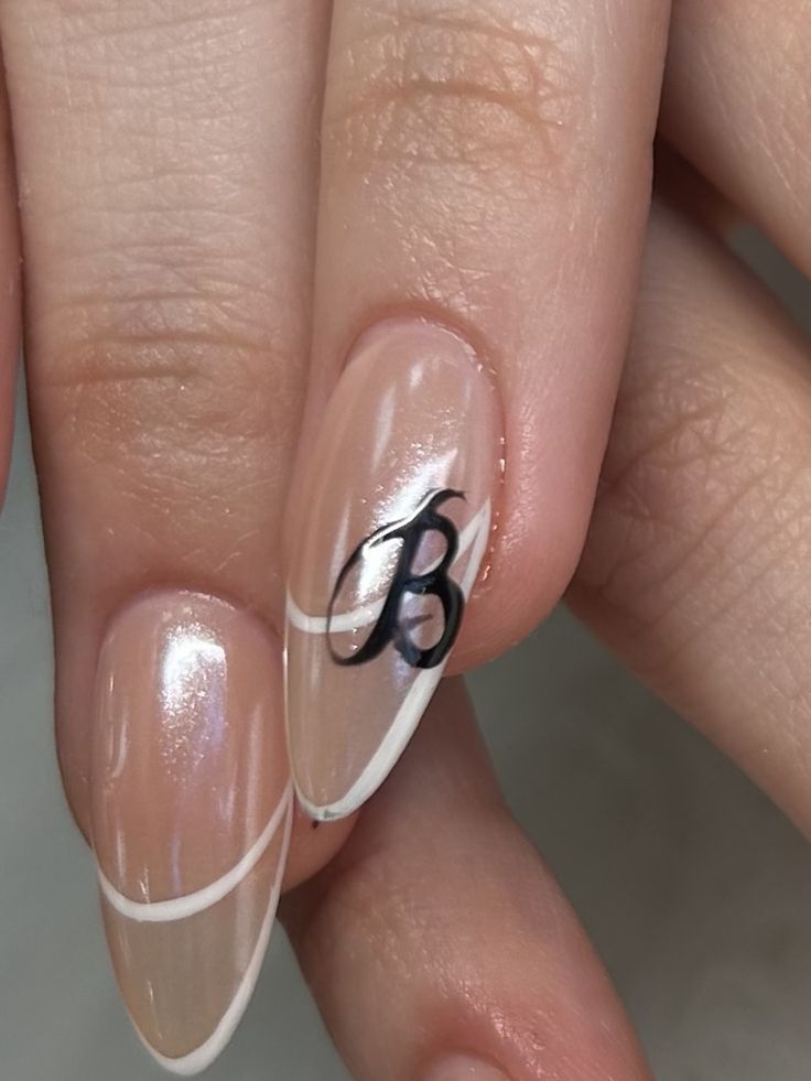 Sophisticated French Tip Nail Design with Bold Personalized Accent.