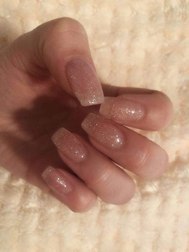 Elegant Nude Nails with Subtle Glitter Gradient for Sophisticated Glamour.