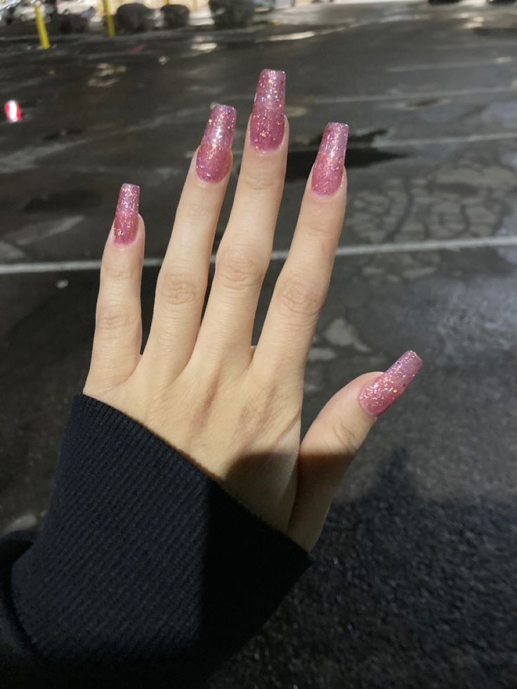 Glamorous Elongated Pink Glitter Nails for a Trendy Sparkle.