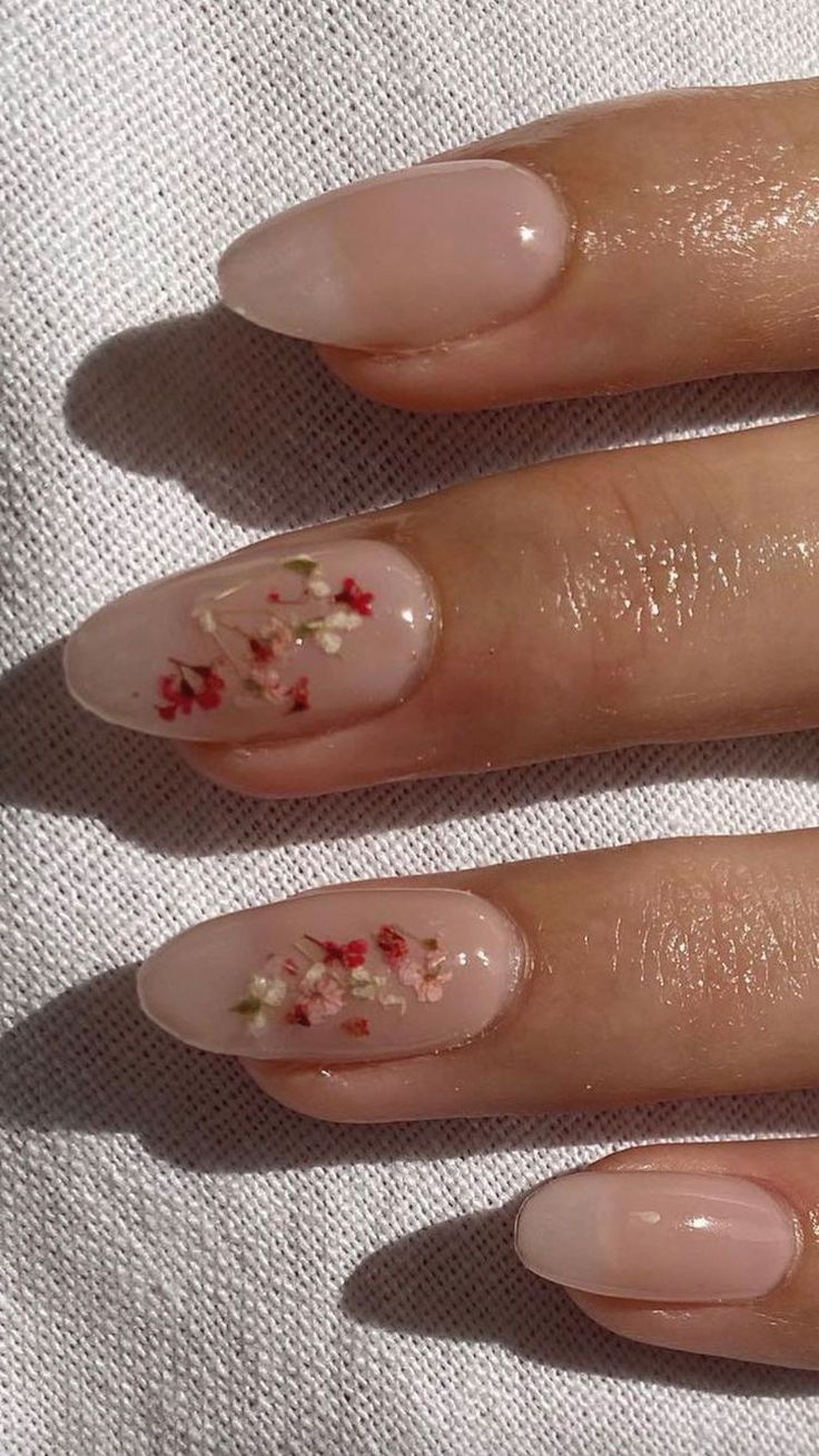 Elegant Floral Nail Design with Soft Pink Base and Glossy Finish