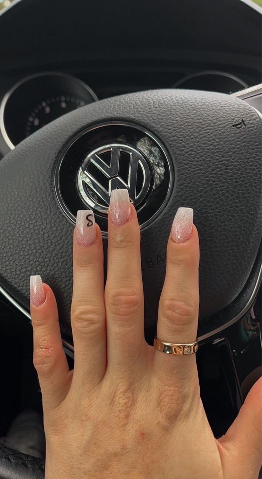 Sophisticated Almond-Shaped Nails with Soft Pink Ombre and Glossy Finish.