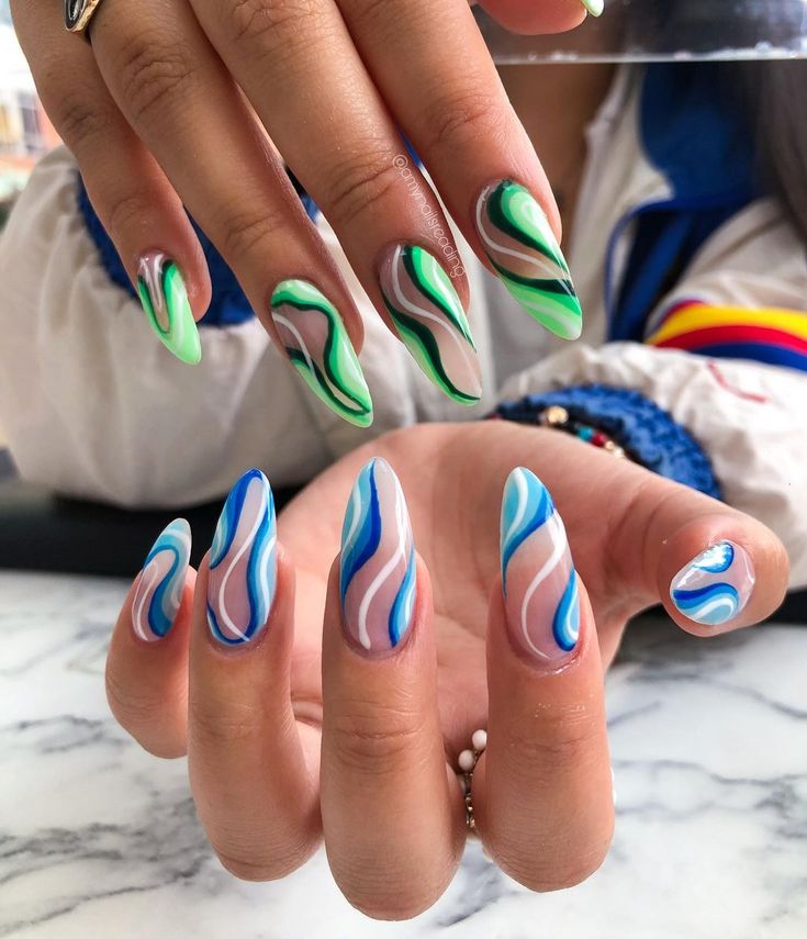 Vibrant Wavy Nail Design in Green, Blue, and White.