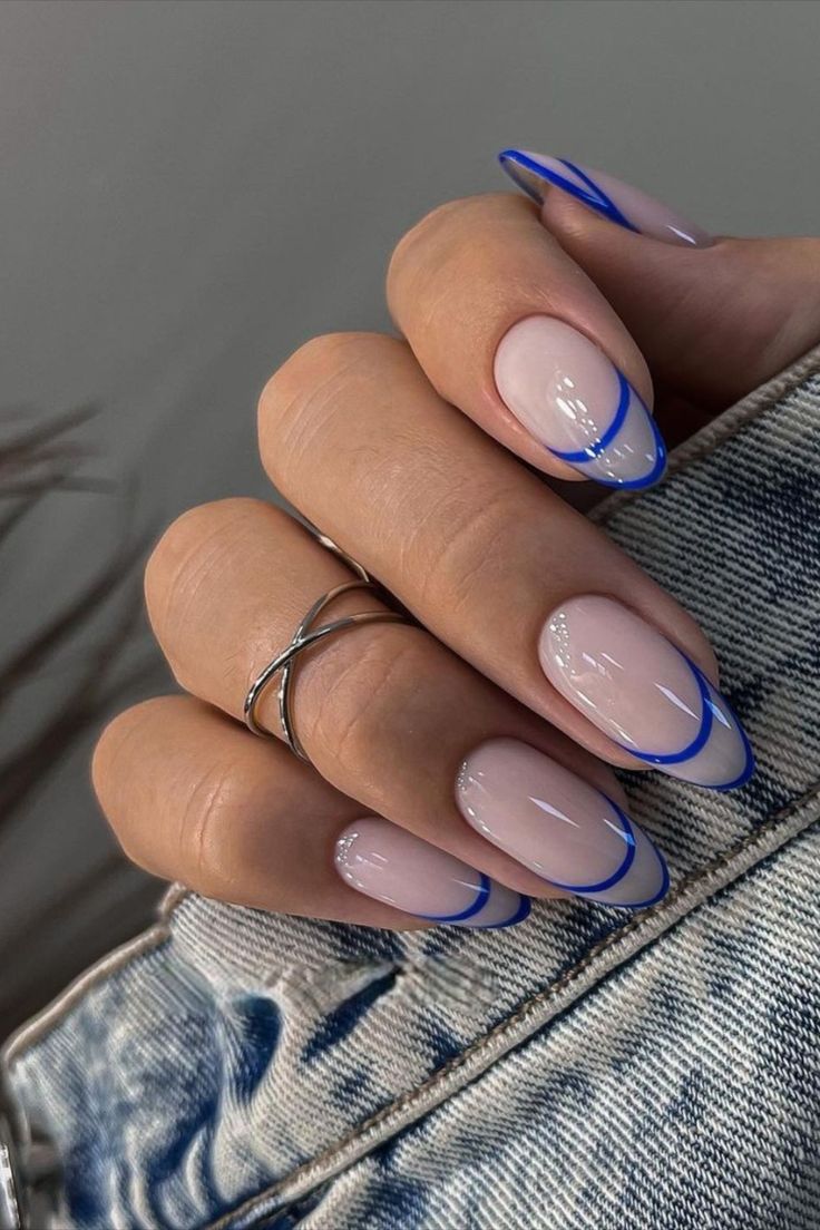 Modern French Manicure: Elegant Clear Base with Bold Blue Outlines