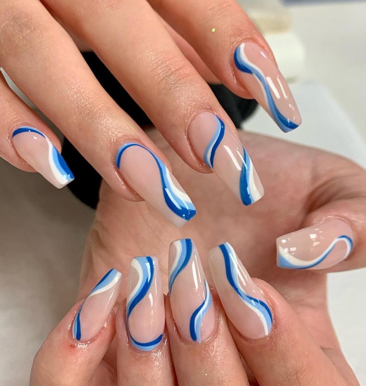 Elegant Nude and Blue Nail Design with Dynamic Waves for Any Occasion.