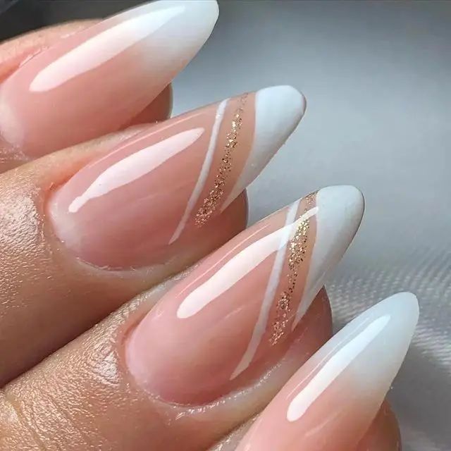 Elegant Ombre Almond Nails with Chic Gold Geometric Accents