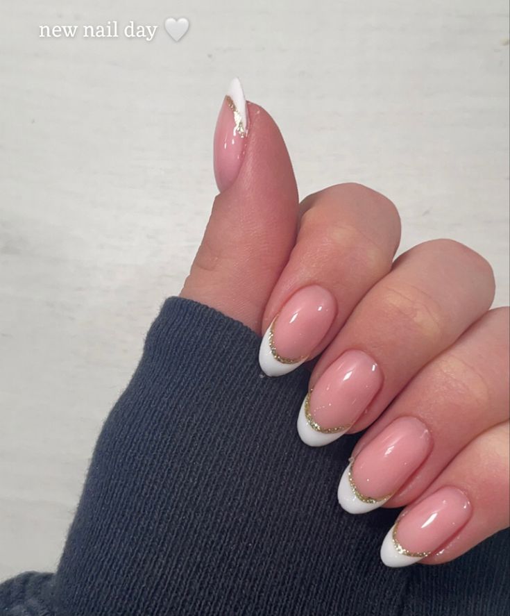 Timeless Elegance: Classic French Tip Nails with Soft Pink Base and Gold Accents.