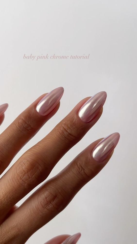 Chic Almond-Shaped Baby Pink Chrome Nails with a Metallic Finish