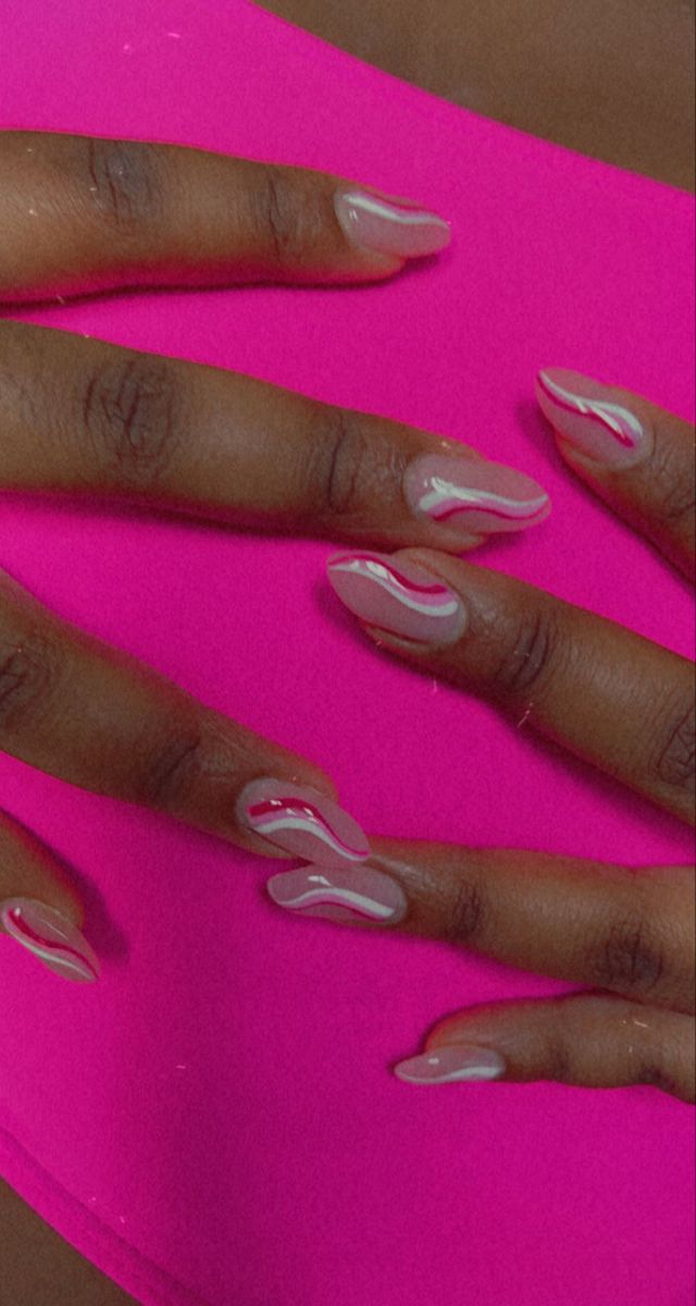 Elegant Swirl Nail Design with Soft Glossy Finish and Warm Contrast Waves.