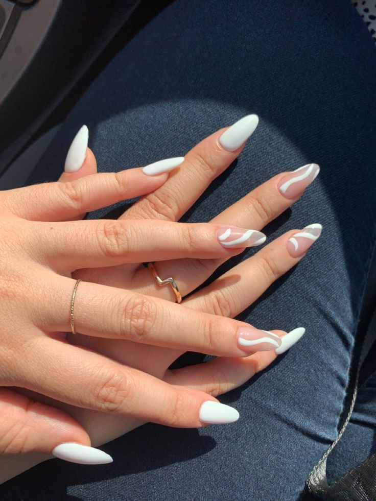 Chic White Almond Nail Design with Elegant Pink Accents.