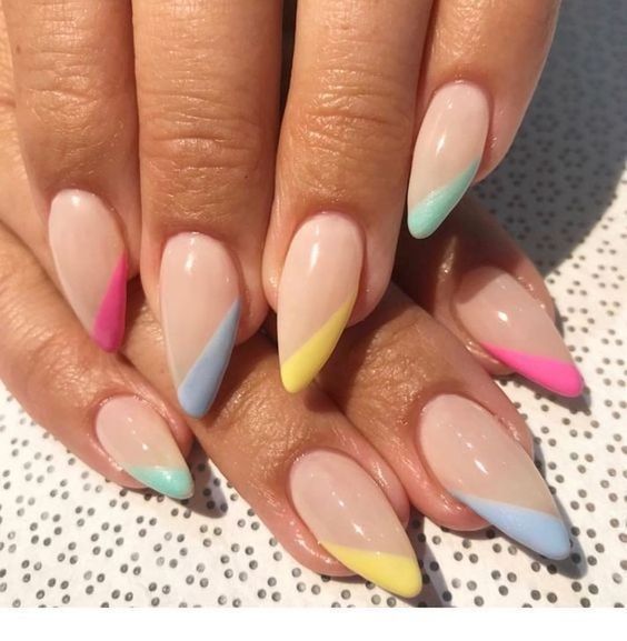 Playful Geometric Nail Design with Soft Nude Base and Colorful Pastel Accents