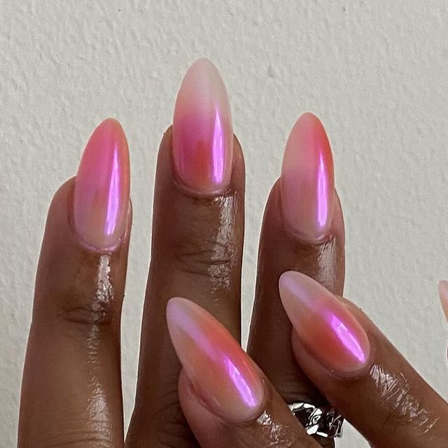 Elegant Ombre Nail Design in Soft Pink and Coral Tones with Glossy Finish.