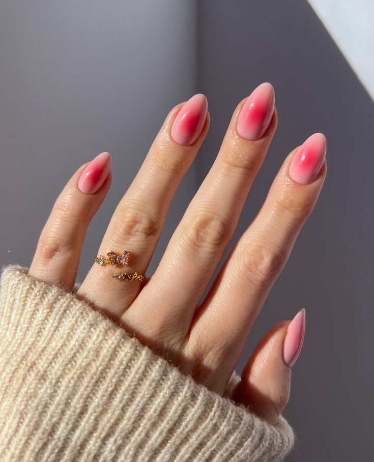 Elegant Ombre Pink Almond Nails: A Chic and Playful Design for Any Occasion.