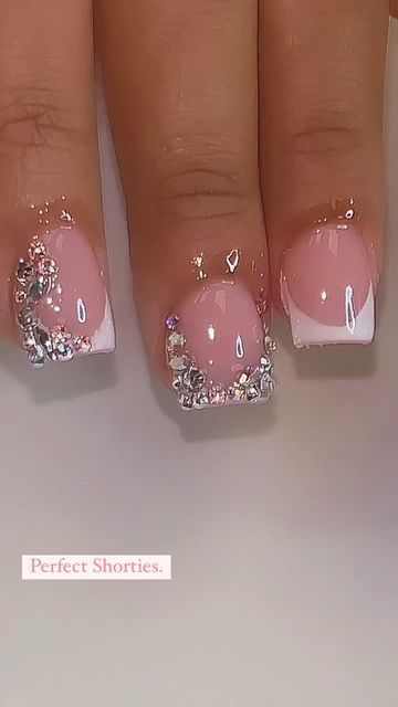 Chic Elegant Short Nails: Soft Pink Base with Clear Accents, White Tips, and Shimmering Gems.