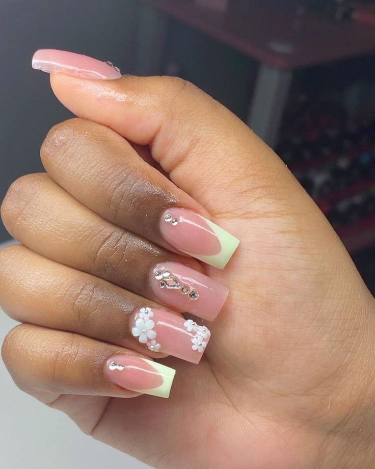 Sophisticated Elegant Nail Design with Soft Pink, Mint Green, Floral Accents, and Sparkling Gems.