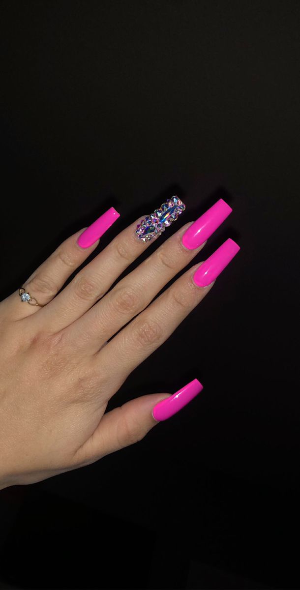 Striking Hot Pink Nails with Sparkling Accent for a Glamorous Statement Look.