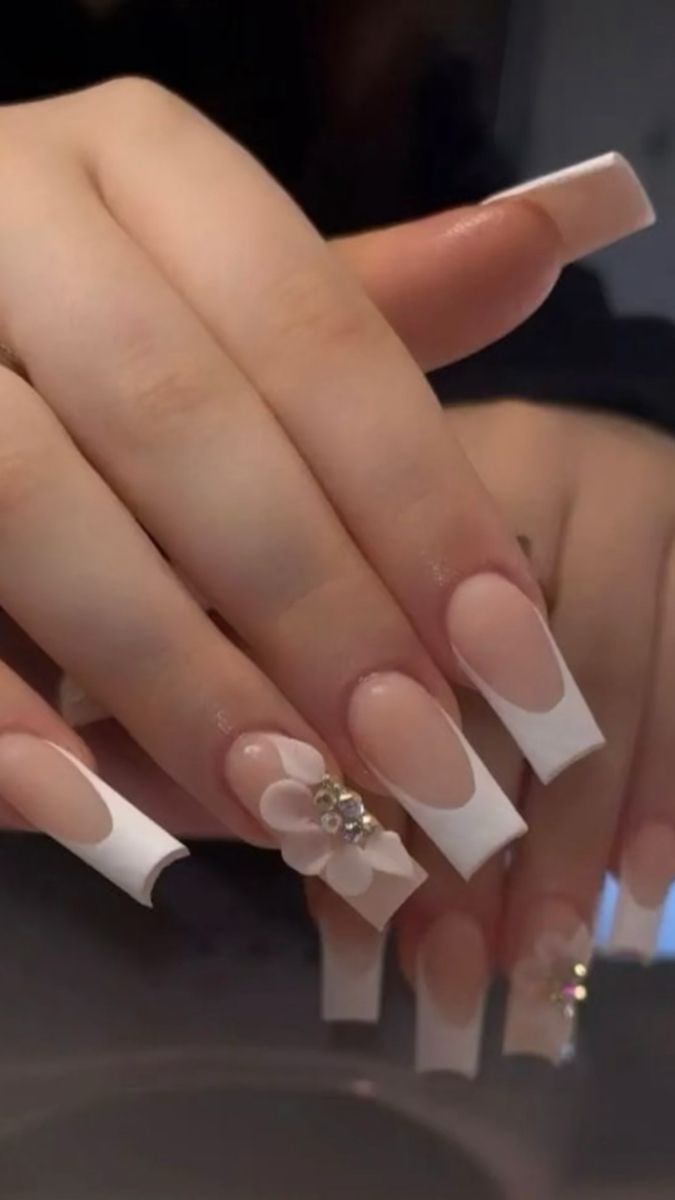 Chic French Manicure with Elegant Long Square Tips and Glamorous Floral Accents.