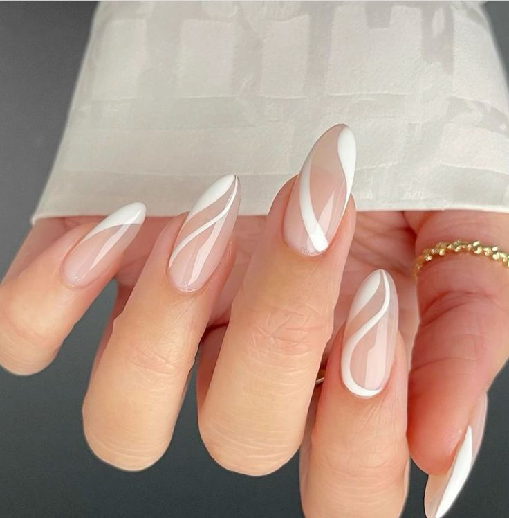 Sophisticated Nude and White Nail Design with Artistic Swirls