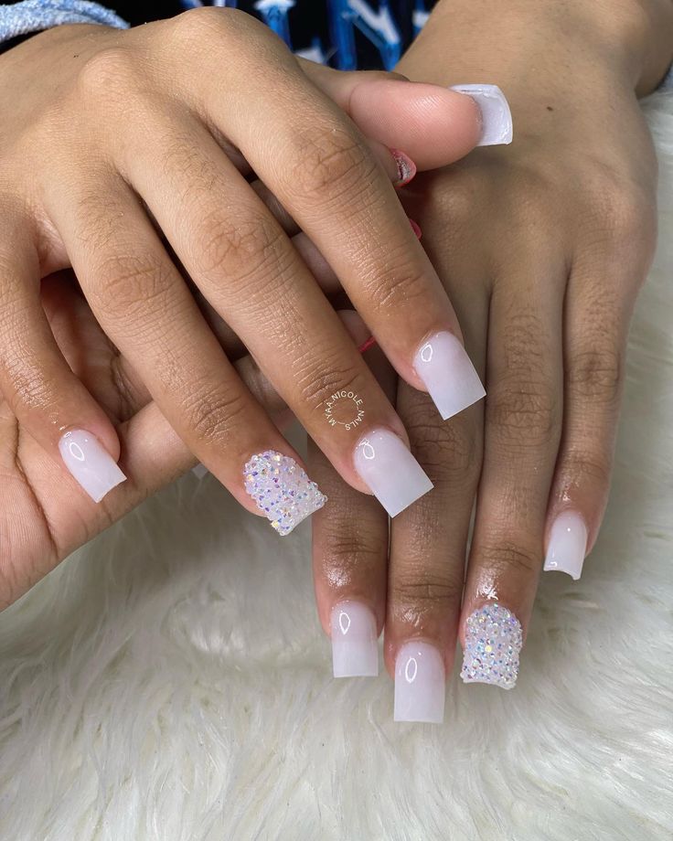 Sophisticated Elegant Nail Design with Soft Pink, Glossy White, and Sparkling Rhinestone Accents.