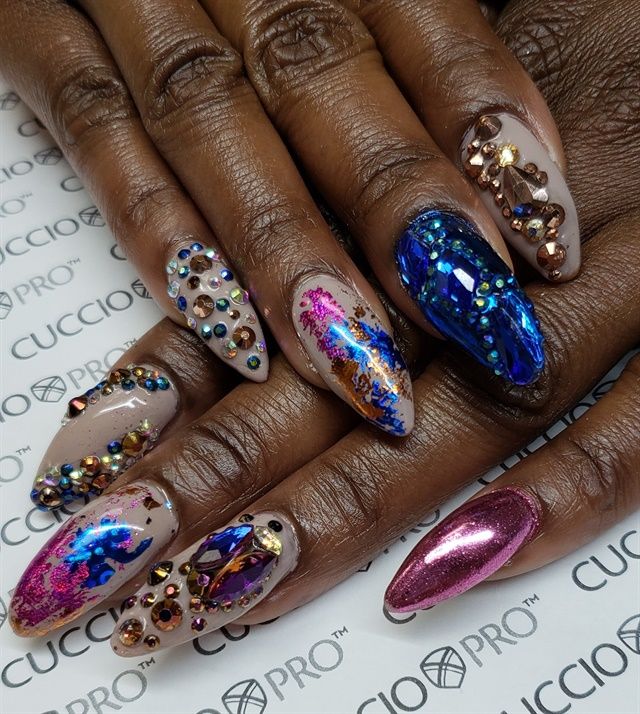 Glamorous Nail Art: Sparkling Embellishments and Vibrant Color Combinations for Special Occasions.