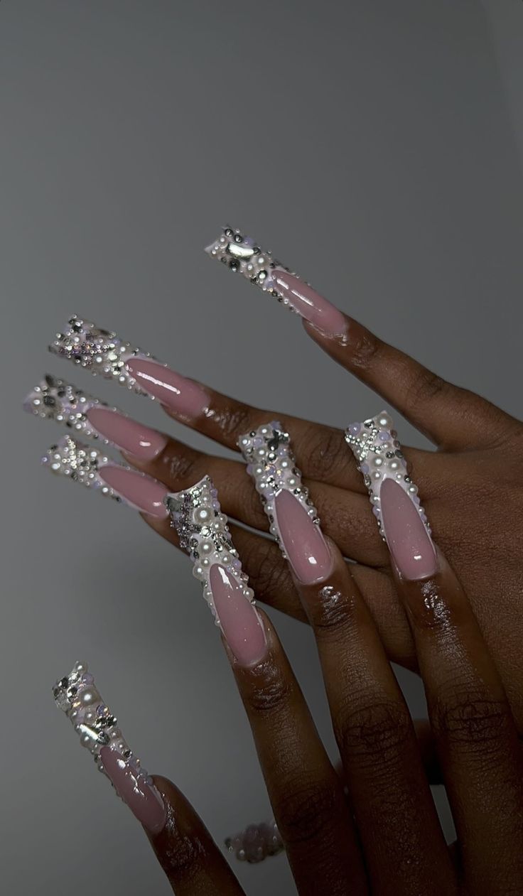 Elegant Pink Long Nails with Intricate Jewels and Glossy Finish.