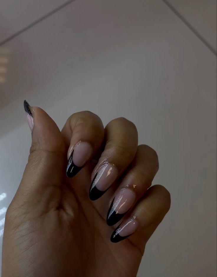 Elegant Nude and Black Gradient Nail Design with Edgy Contrast.