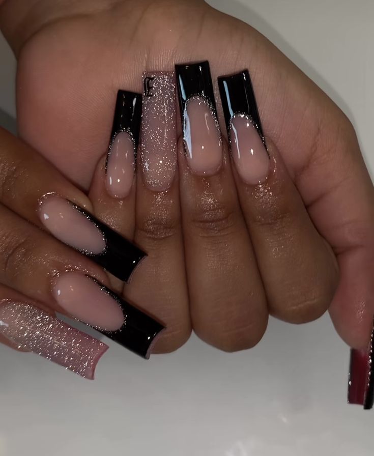 Elegant Nail Design: Glossy Black and Nude French Tips with Glitter Accents