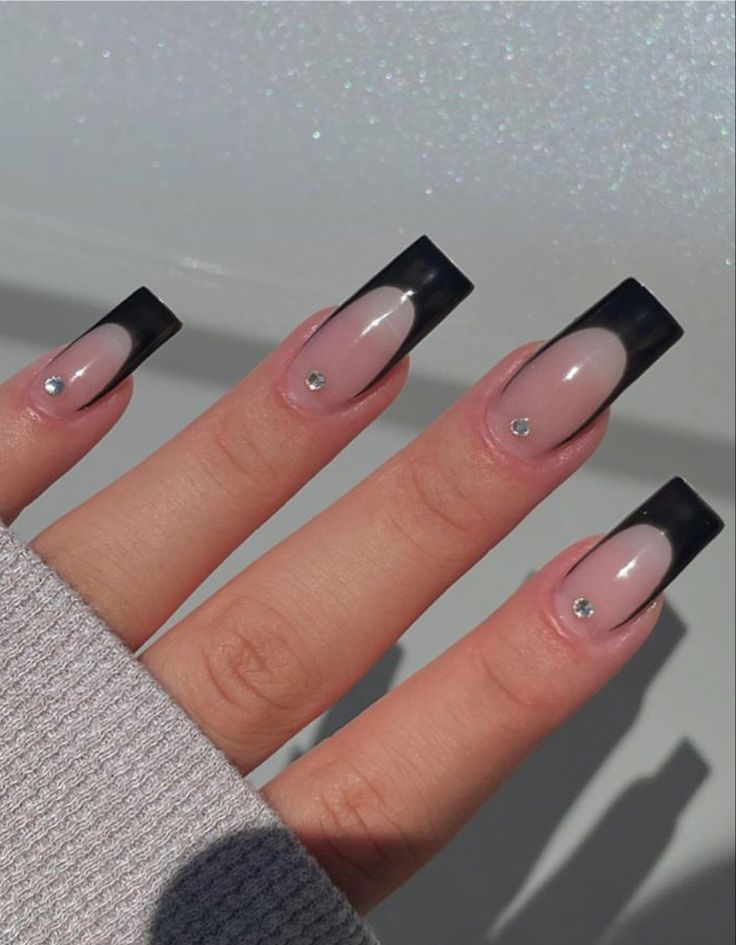 Elegant Black-Tipped Nail Design with Nude Base and Rhinestone Accents