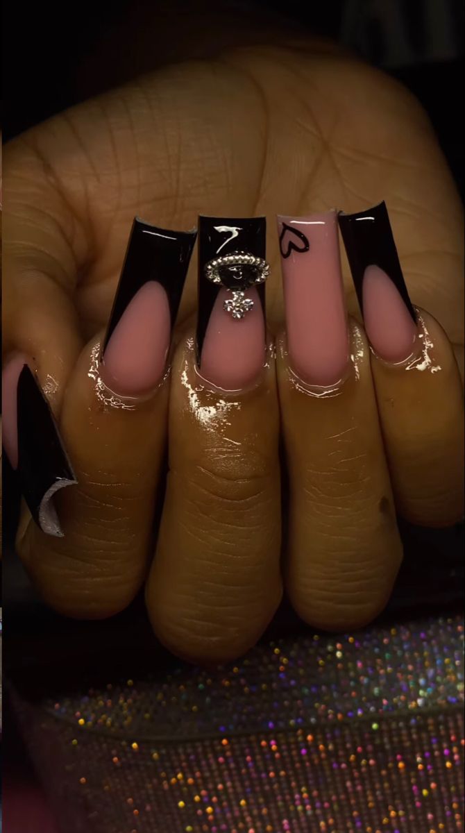 Chic Nail Design: Sleek Black Tips with Soft Pink Base and Glamorous Embellishments