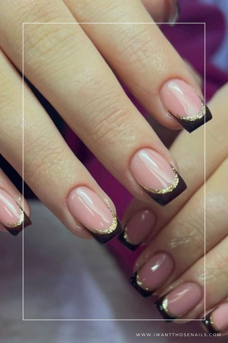 Sophisticated French Manicure Redefined: Nude Base, Deep Brown Tips, and Gold Accents.