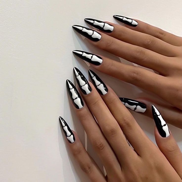 Bold Black and White Geometric Pointed Nail Art for Statement Style.