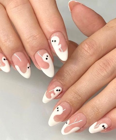 Whimsical Ghost-Inspired French Nail Design with Nude and White Shades.