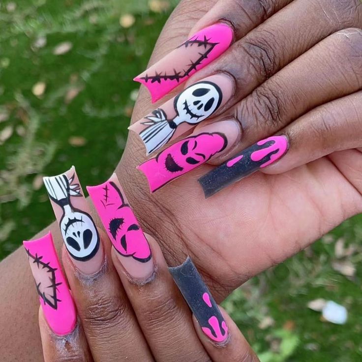 Vibrant Pink Halloween-Inspired Bold Nail Design with Playful Motifs and Mixed Finishes.